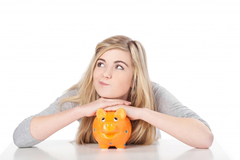 Woman on her piggy bank