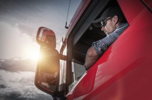 Driver in his red truck