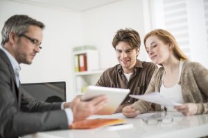 Real estate agent talking to couple