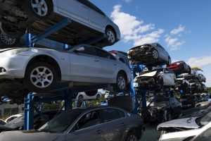 cars being piled for recycling