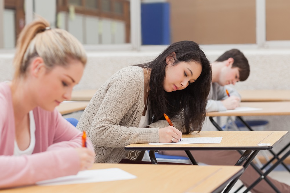 students in a classroom taking a test