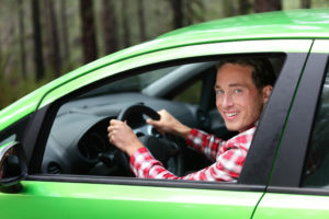 Man inside his green car