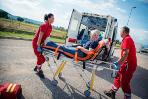 man being placed into the ambulance