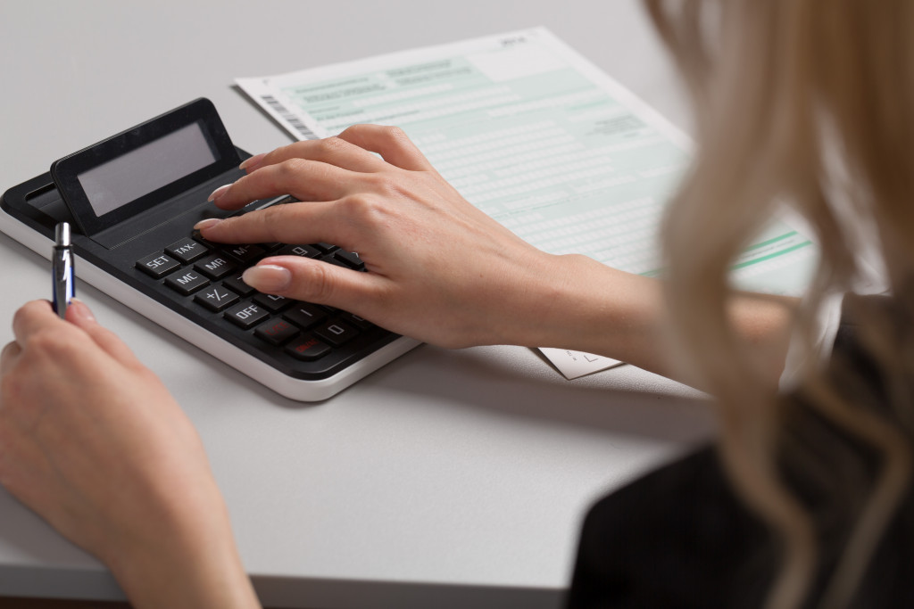an accountant using a calculator