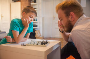 A father and son playing chess